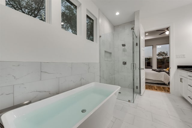 1403 Pueblo St, Dallas, TX 75212 - bathroom featuring a freestanding tub, marble finish floors, a shower stall, recessed lighting, and connected bathroom