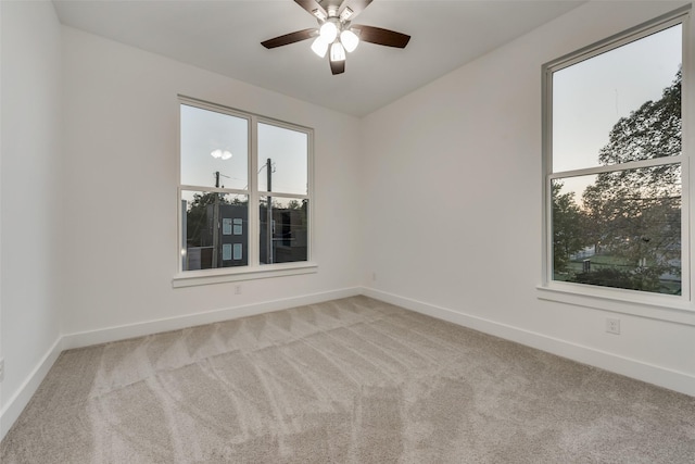 1403 Pueblo St, Dallas, TX 75212 - unfurnished room featuring carpet floors, healthy amount of natural light, and a ceiling fan