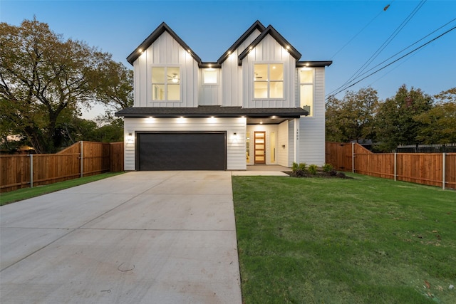 1403 Pueblo St, Dallas, TX 75212 - view of front of property with a garage, driveway, and board and batten siding