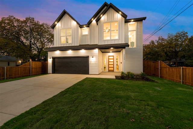 1403 Pueblo St, Dallas, TX 75212 - view of front of home with a garage, concrete driveway, and board and batten siding