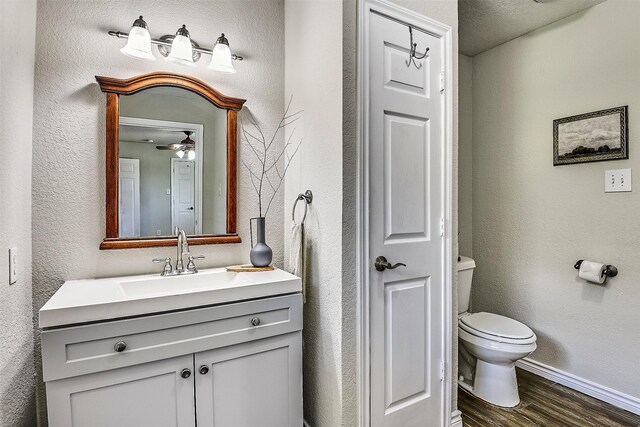 351 Marion Rd, Venus, TX 76084 - bathroom featuring wood finished floors, vanity, a textured wall, and ceiling fan