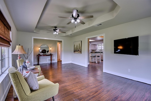 351 Marion Rd, Venus, TX 76084 - living area featuring a raised ceiling, wood finished floors, and a ceiling fan