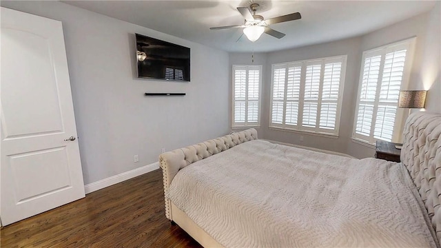 1320 Ponca St, Carrollton, TX 75010 - bedroom with dark wood finished floors, multiple windows, and ceiling fan