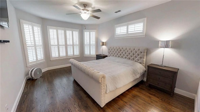 1320 Ponca St, Carrollton, TX 75010 - bedroom featuring multiple windows, dark wood-style flooring, and a ceiling fan