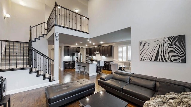 1320 Ponca St, Carrollton, TX 75010 - living area featuring a high ceiling, stairs, and dark wood-type flooring