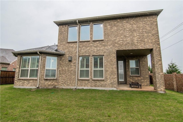 1320 Ponca St, Carrollton, TX 75010 - rear view of property featuring a patio, a fenced backyard, brick siding, and an outdoor fire pit