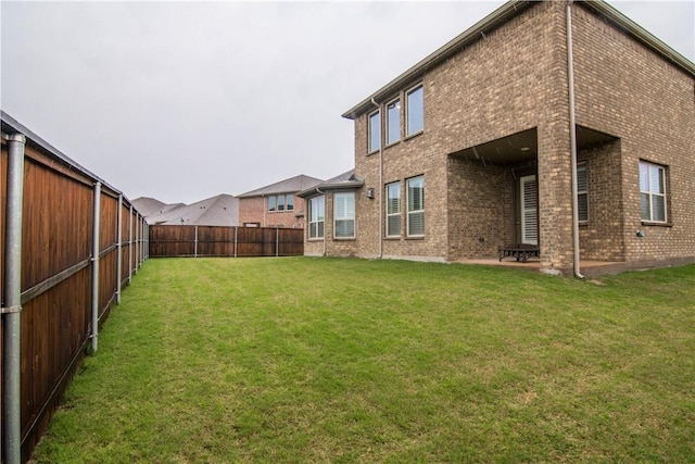 1320 Ponca St, Carrollton, TX 75010 - back of property featuring a fenced backyard and brick siding