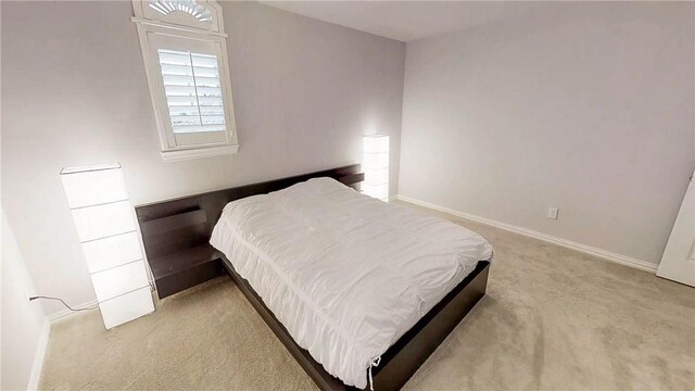 1320 Ponca St, Carrollton, TX 75010 - carpeted bedroom featuring baseboards
