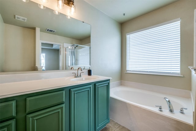 9032 Eagle Dr, Providence Village, TX 76227 - full bath featuring plenty of natural light, a garden tub, vanity, and a shower stall