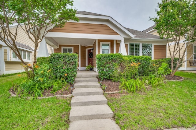 9032 Eagle Dr, Providence Village, TX 76227 - bungalow-style house featuring a front yard, covered porch, and a shingled roof