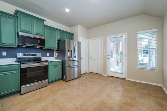 9032 Eagle Dr, Providence Village, TX 76227 - kitchen with green cabinetry, stainless steel appliances, light countertops, lofted ceiling, and recessed lighting