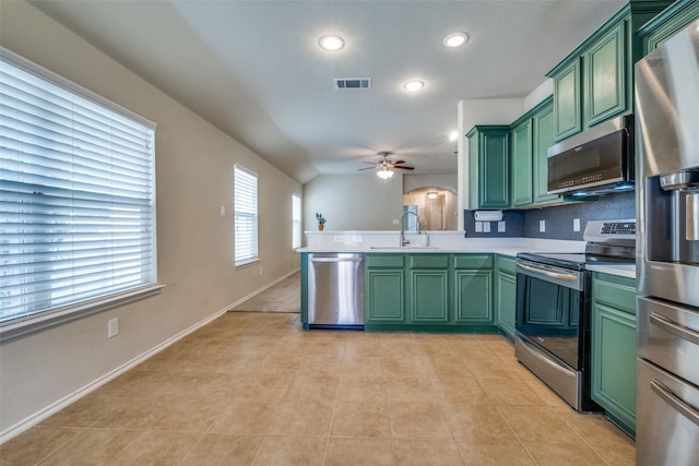9032 Eagle Dr, Providence Village, TX 76227 - kitchen featuring green cabinetry, stainless steel appliances, light countertops, a ceiling fan, and recessed lighting