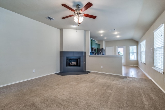9032 Eagle Dr, Providence Village, TX 76227 - unfurnished living room with light carpet, a ceiling fan, a fireplace, and lofted ceiling