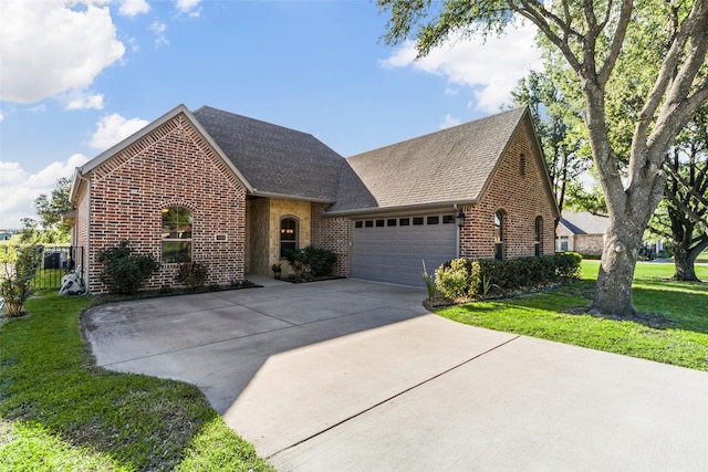 3014 Preston Club Dr, Sherman, TX 75092 - view of front of property with brick siding, concrete driveway, an attached garage, a front lawn, and roof with shingles