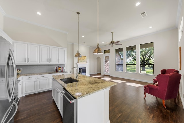 3014 Preston Club Dr, Sherman, TX 75092 - kitchen with appliances with stainless steel finishes, open floor plan, backsplash, a fireplace, and dark wood finished floors