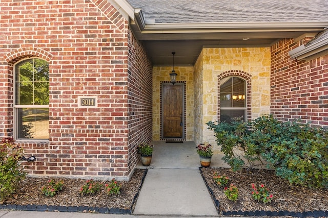 3014 Preston Club Dr, Sherman, TX 75092 - view of exterior entry with a shingled roof and brick siding