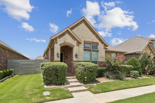 913 Parkside Dr, Argyle, TX 76226 - view of front of home with stone siding, brick siding, and roof with shingles