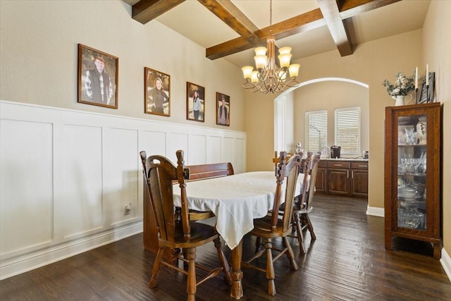 2213 Therese Dr, Waco, TX 76712 - dining space with arched walkways, beam ceiling, coffered ceiling, a chandelier, and wainscoting
