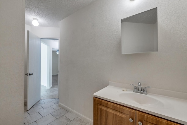 6414 Seaford Rd, Arlington, TX 76001 - bathroom featuring vanity, tile patterned floors, and a textured ceiling