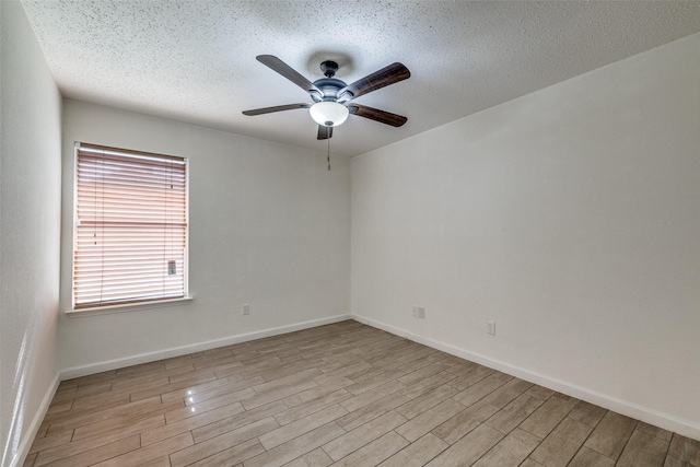 6414 Seaford Rd, Arlington, TX 76001 - empty room featuring a ceiling fan, wood finished floors, and a textured ceiling