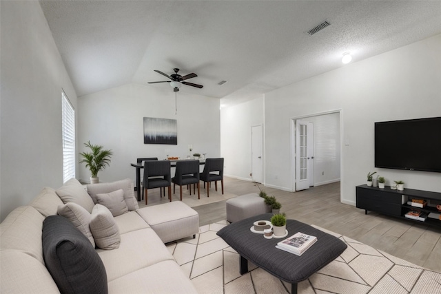6414 Seaford Rd, Arlington, TX 76001 - living room with light wood-style flooring, ceiling fan, and vaulted ceiling