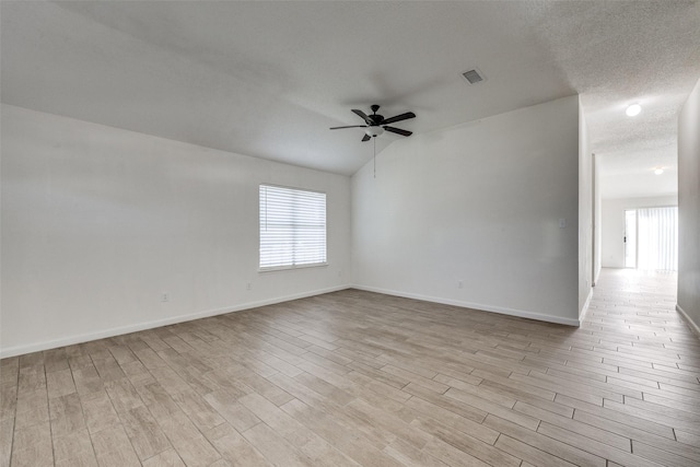 6414 Seaford Rd, Arlington, TX 76001 - empty room featuring healthy amount of natural light, light wood-style flooring, ceiling fan, and lofted ceiling