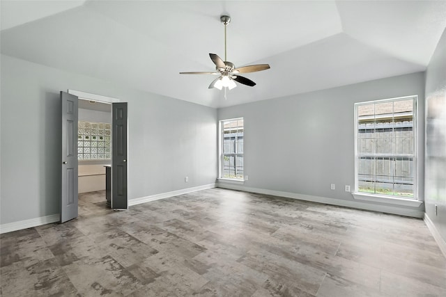 8301 Concord Dr, Rowlett, TX 75089 - spare room featuring ceiling fan, healthy amount of natural light, and lofted ceiling