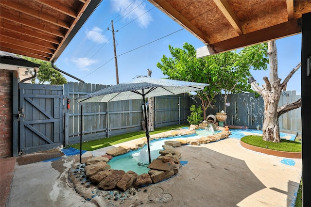 8301 Concord Dr, Rowlett, TX 75089 - fenced backyard with a gate and a patio
