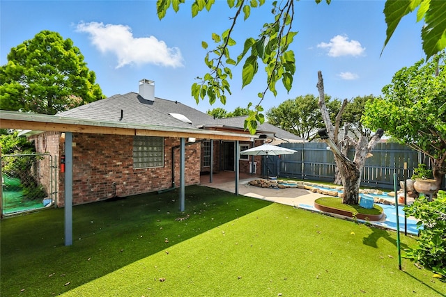 8301 Concord Dr, Rowlett, TX 75089 - back of house featuring brick siding, a fenced backyard, a patio, a chimney, and a shingled roof