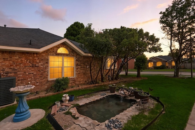 8301 Concord Dr, Rowlett, TX 75089 - yard at dusk with a yard