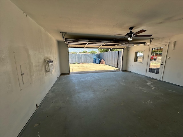 8301 Concord Dr, Rowlett, TX 75089 - garage with ceiling fan, electric panel, and heating unit