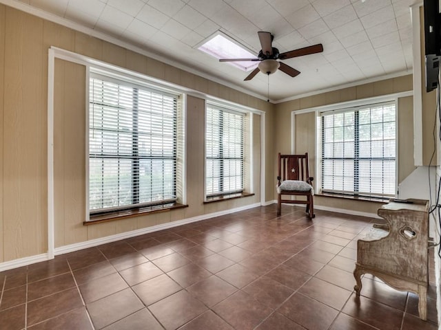 713 Bordner Dr, Lancaster, TX 75146 - living area featuring ornamental molding, tile patterned floors, a ceiling fan, and healthy amount of natural light