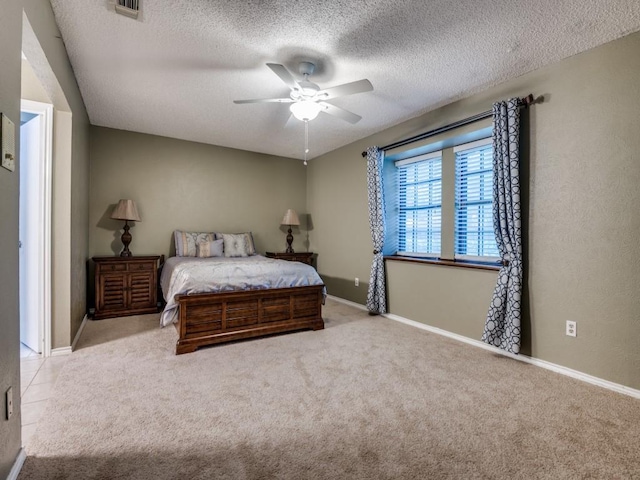 713 Bordner Dr, Lancaster, TX 75146 - carpeted bedroom featuring a textured ceiling and ceiling fan