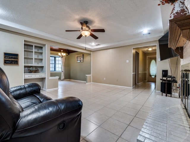 713 Bordner Dr, Lancaster, TX 75146 - living area featuring light tile patterned flooring, a ceiling fan, a textured ceiling, and a chandelier