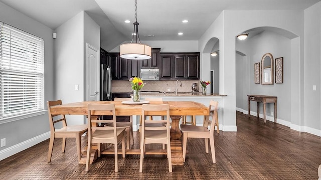 3513 Holly Rd, Melissa, TX 75454 - dining space featuring arched walkways, plenty of natural light, and recessed lighting