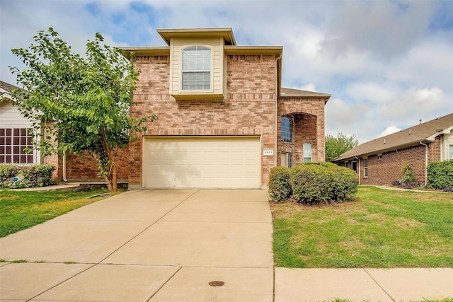 5831 Melanie Ct, Fort Worth, TX 76131 - view of front facade featuring an attached garage, brick siding, a front yard, and concrete driveway