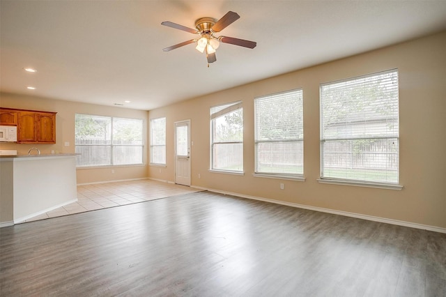 5831 Melanie Ct, Fort Worth, TX 76131 - unfurnished living room with light wood-type flooring, recessed lighting, and a ceiling fan