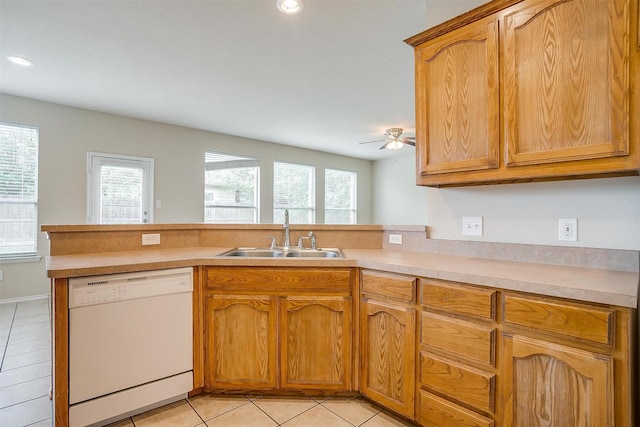 5831 Melanie Ct, Fort Worth, TX 76131 - kitchen with white dishwasher, light tile patterned floors, light countertops, a peninsula, and a ceiling fan