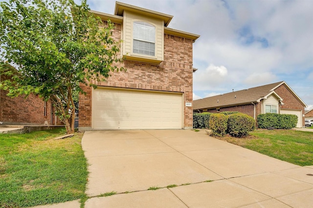 5831 Melanie Ct, Fort Worth, TX 76131 - view of front facade with a garage, brick siding, a front lawn, and driveway
