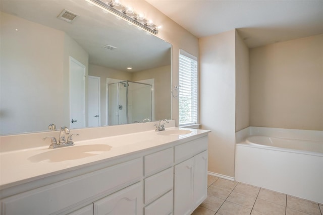 5831 Melanie Ct, Fort Worth, TX 76131 - full bathroom featuring a stall shower, tile patterned flooring, a bath, and double vanity