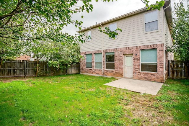 5831 Melanie Ct, Fort Worth, TX 76131 - rear view of house featuring a fenced backyard, brick siding, and a patio area