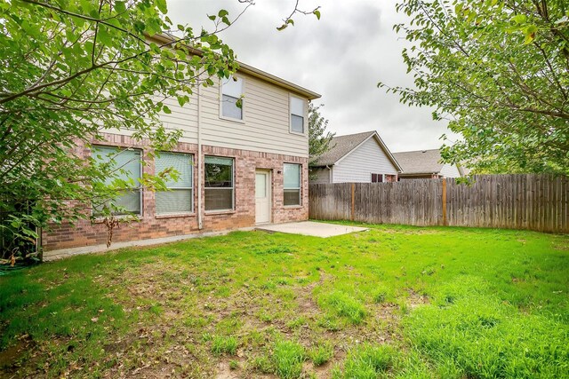 5831 Melanie Ct, Fort Worth, TX 76131 - back of property with a patio area and brick siding