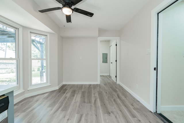 3733 Magnolia Dr, Grand Prairie, TX 75052 - spare room featuring light wood-style floors, electric panel, and a ceiling fan