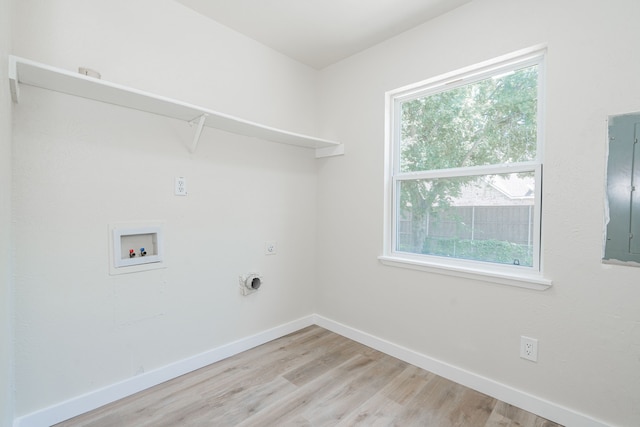 3733 Magnolia Dr, Grand Prairie, TX 75052 - washroom with hookup for a washing machine, light wood-type flooring, hookup for an electric dryer, and electric panel