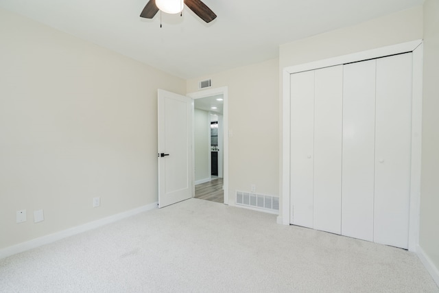 3733 Magnolia Dr, Grand Prairie, TX 75052 - unfurnished bedroom featuring carpet, a closet, and a ceiling fan