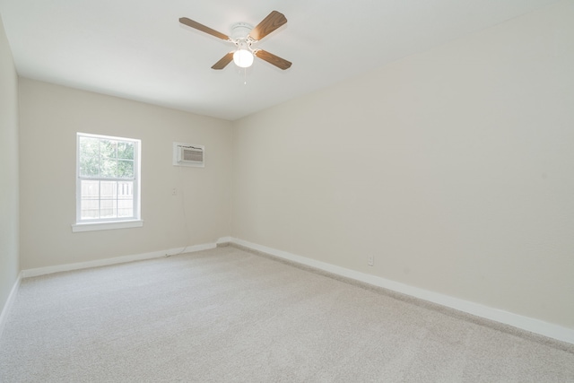 3733 Magnolia Dr, Grand Prairie, TX 75052 - empty room with an AC wall unit, light colored carpet, and a ceiling fan