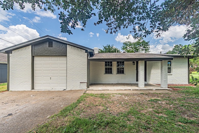 5307 Kelly Elliott, Arlington, TX 76017 - view of front of home featuring brick siding, concrete driveway, a porch, and an attached garage