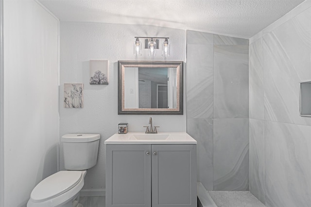5307 Kelly Elliott, Arlington, TX 76017 - full bath with vanity, a textured ceiling, and a shower