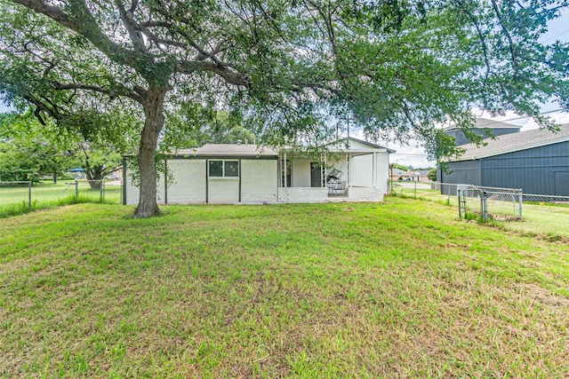 5307 Kelly Elliott, Arlington, TX 76017 - back of house featuring a fenced backyard and brick siding