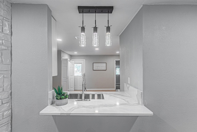 5307 Kelly Elliott, Arlington, TX 76017 - bathroom featuring a sink and a textured wall